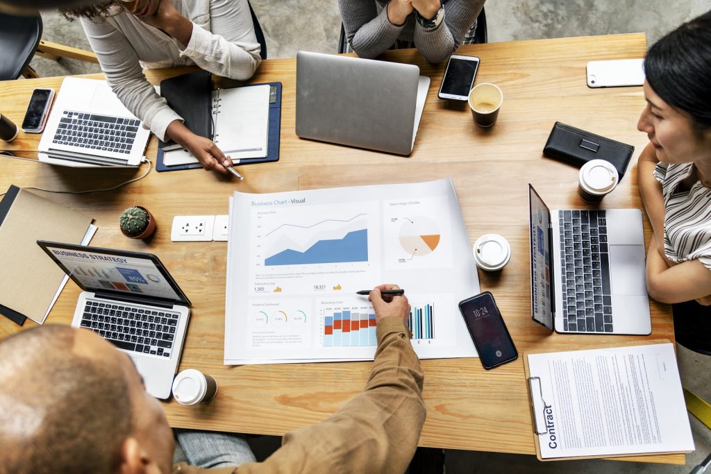 group of technical writers in Essential Data Corp having a business meeting