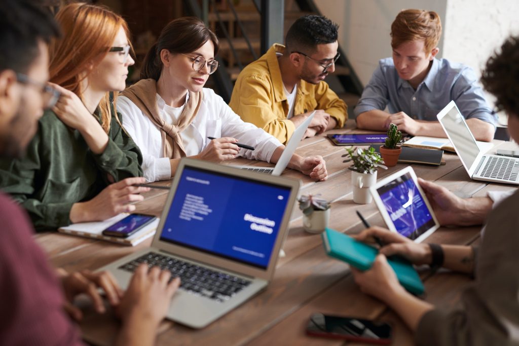 Technical writers sitting around a large table